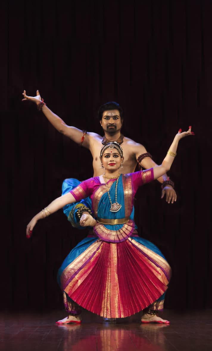 Trikāyaa duet performance in blue and gold costume